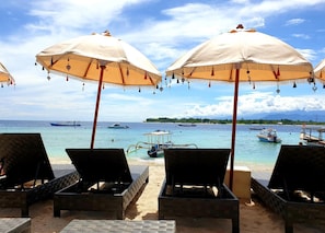 Beach nearby, white sand, sun loungers, beach umbrellas