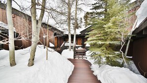 A wooden pathway leading to a building with a wooden door and steps. - Near Trails! Big Deck! Easy Drive to Dining, Events, Activities, Lake (Silverthorne)