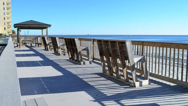 A wooden boardwalk with benches and a gazebo overlooking the ocean. - Sea Oaks 304 - Oceanfront in Garden City Beach (Garden City)