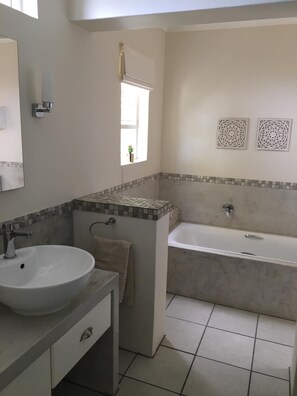 Bathtub, hair dryer, towels, soap