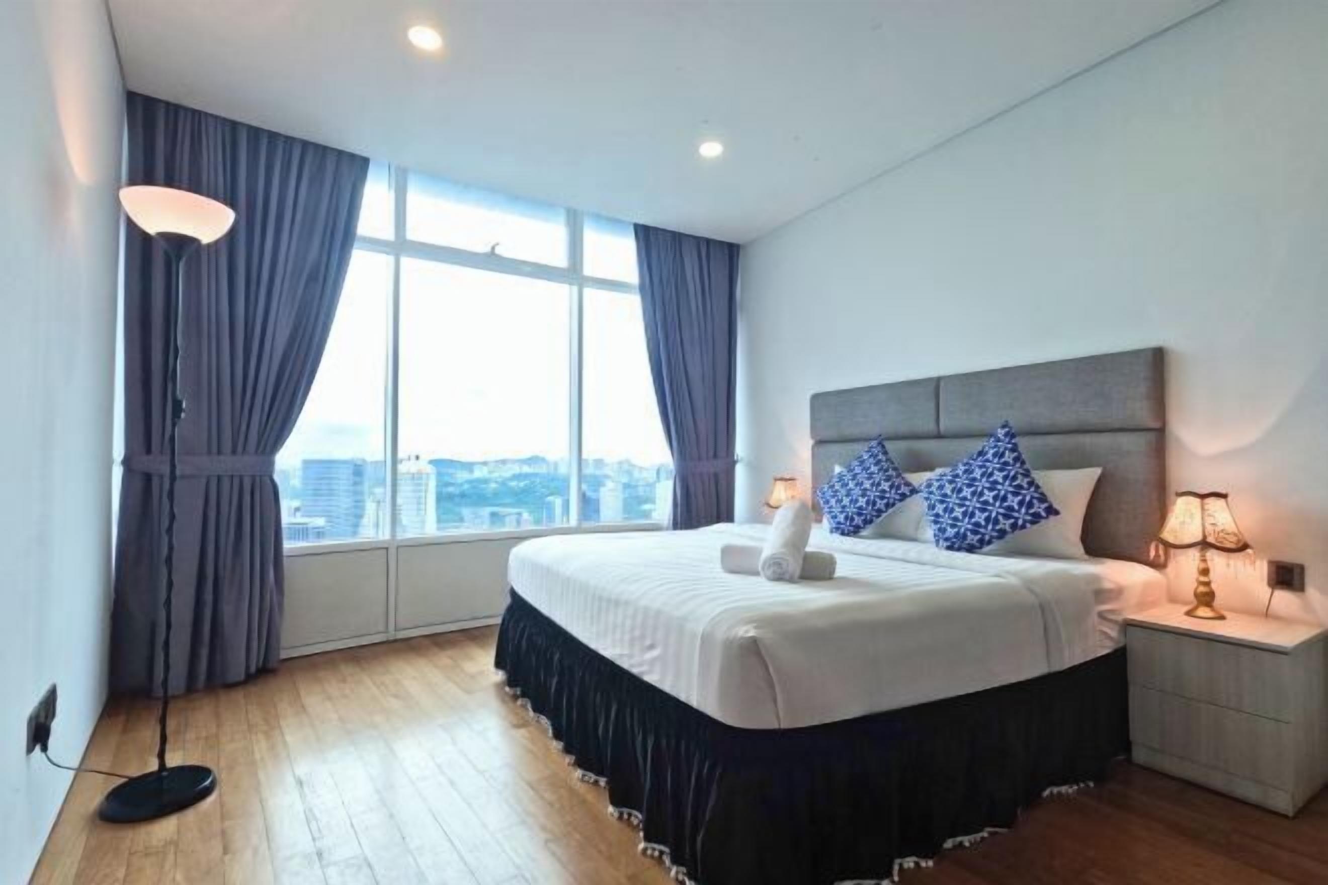 Laptop workspace, iron/ironing board, bed sheets