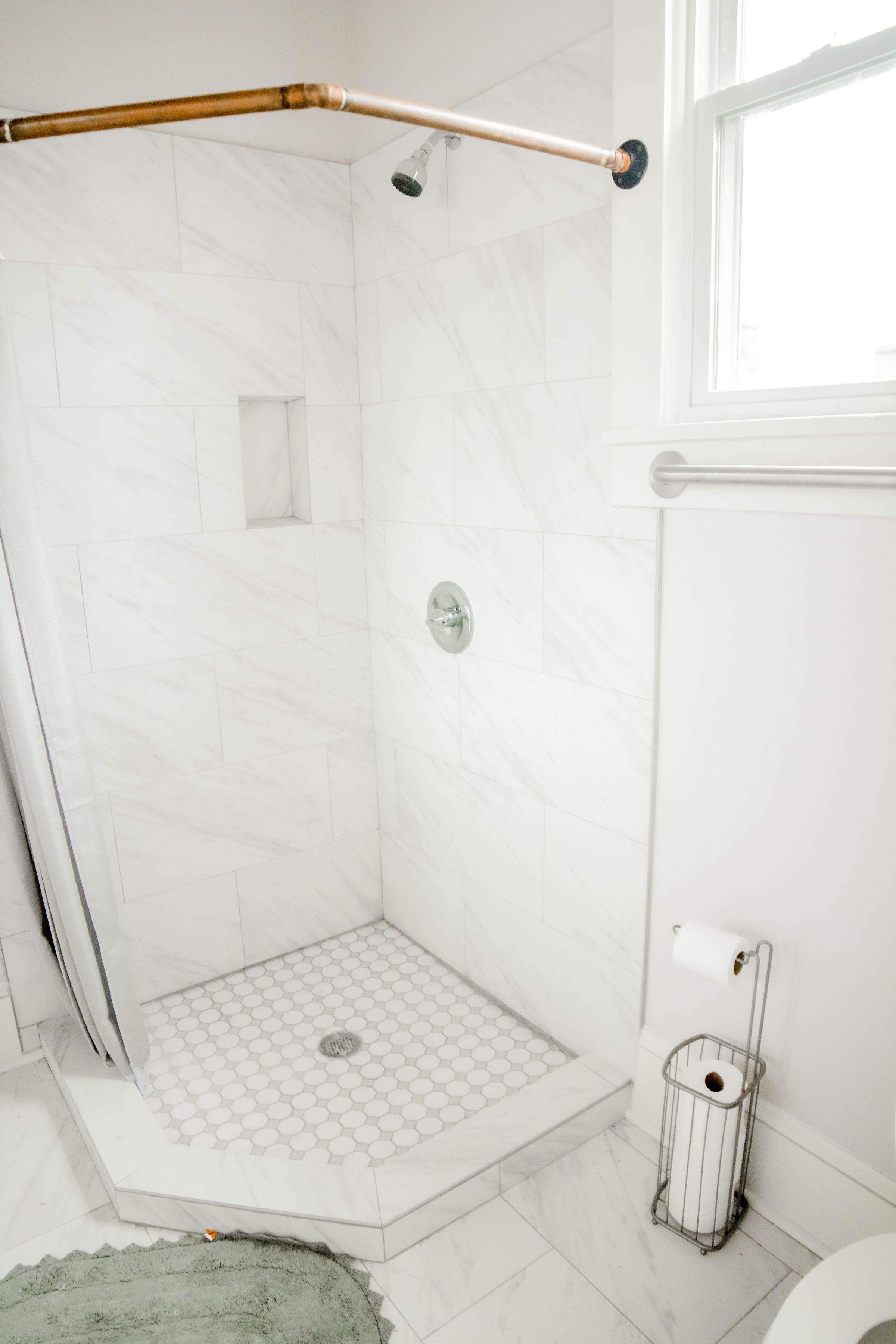 Combined shower/tub, hair dryer, towels, toilet paper