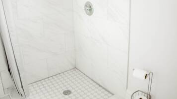 Combined shower/tub, hair dryer, towels, toilet paper