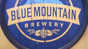 A wooden barrel with the text "BLUE MOUNTAIN BREWERY" and a mountain graphic. - Fantastic Post & Beam 5br Valley location near All Pool, Lake, Beach, Sleep 16 (Nellysford)