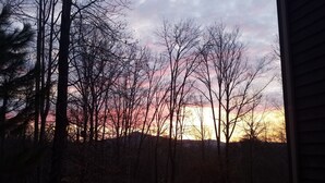 A view of a forested area with a sunset in the background. - Fantastic Post & Beam 5br Valley location near All Pool, Lake, Beach, Sleep 16 (Nellysford)