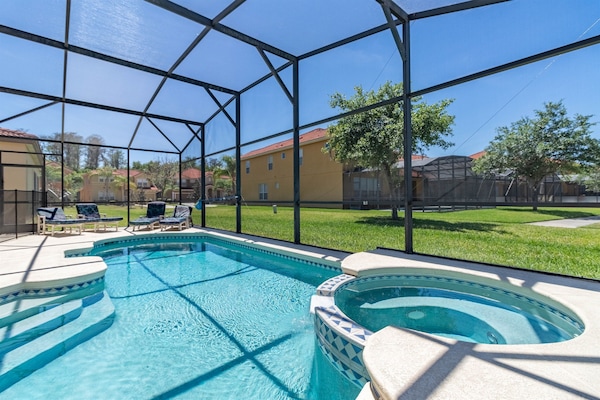 Private screened pool and spa in a secure gated resort, ideal for relaxing after visiting the parks