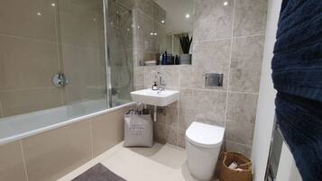 Luxury Apartment | Bathroom | Designer toiletries, hair dryer, slippers, heated floors