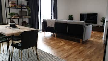 Luxury Apartment | Living area | 60-inch Smart TV with cable channels, TV, Netflix