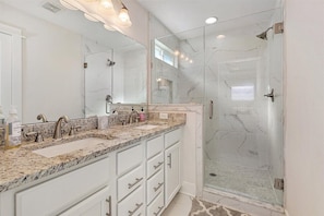 Combined shower/tub, hair dryer, towels, soap