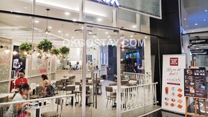 A TOAST BOX restaurant with a modern interior, visible seating arrangements, and a glass storefront. - Zenith Suites JBCC by OKGOSTAY (Johor Bahru)