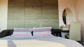 Desk, blackout drapes, WiFi (free), bed sheets