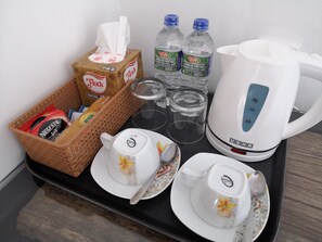 Enjoy a convenient stay with essentials at your fingertips, including a coffee maker, bottled water, and facial tissue.