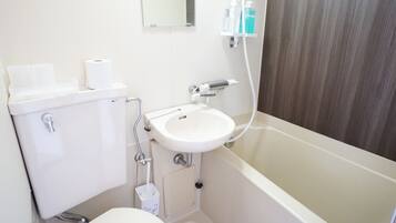 Combined shower/tub, free toiletries, hair dryer, slippers
