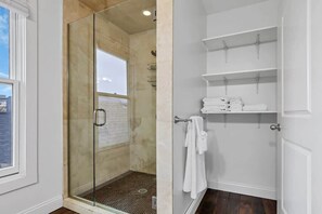 Shower, hair dryer, towels, shampoo