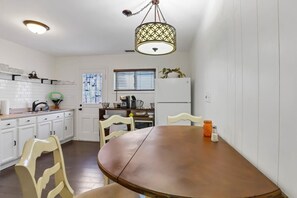Enjoy cooking in this well-equipped kitchen with a central island, oven, and refrigerator.