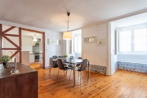 Enjoy meals in this dining area with a large table and comfortable chairs.
