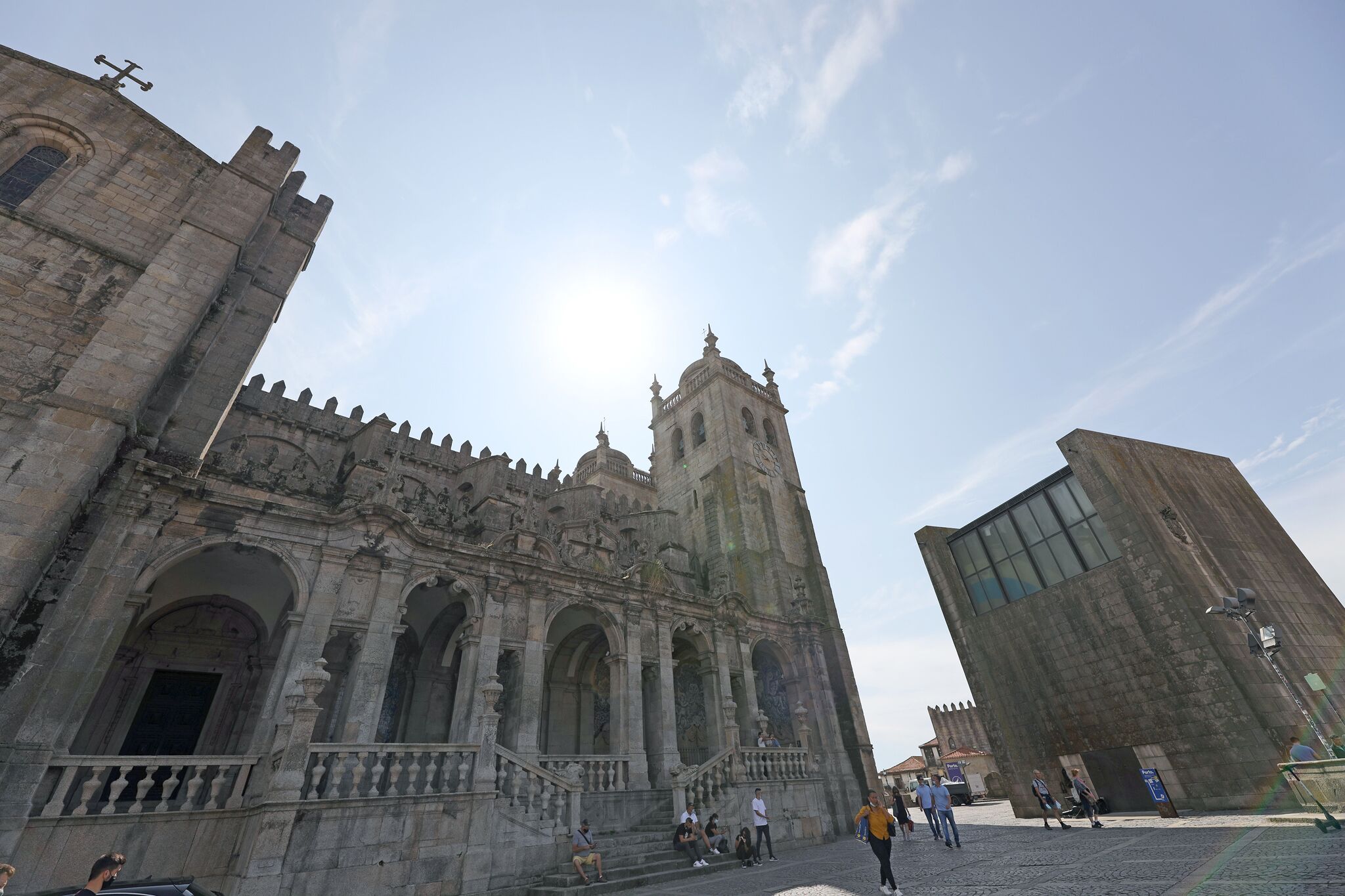 A historic building with a prominent tower and arched windows.