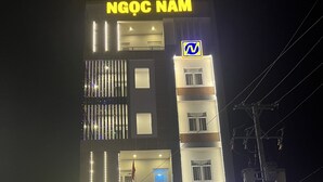 A hotel with a prominent sign reading "NGOC NAM HOTEL" and a logo above the entrance. - Ngoc Nam Hotel (La Gi)