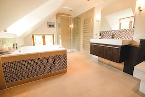 Separate bathtub and shower, towels