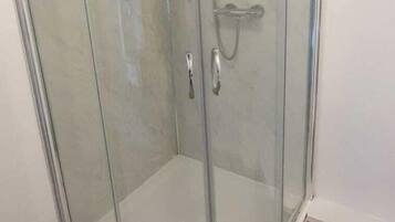 Shower, hydromassage showerhead, hair dryer, towels