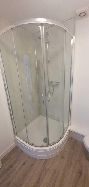 Shower, hydromassage showerhead, hair dryer, towels