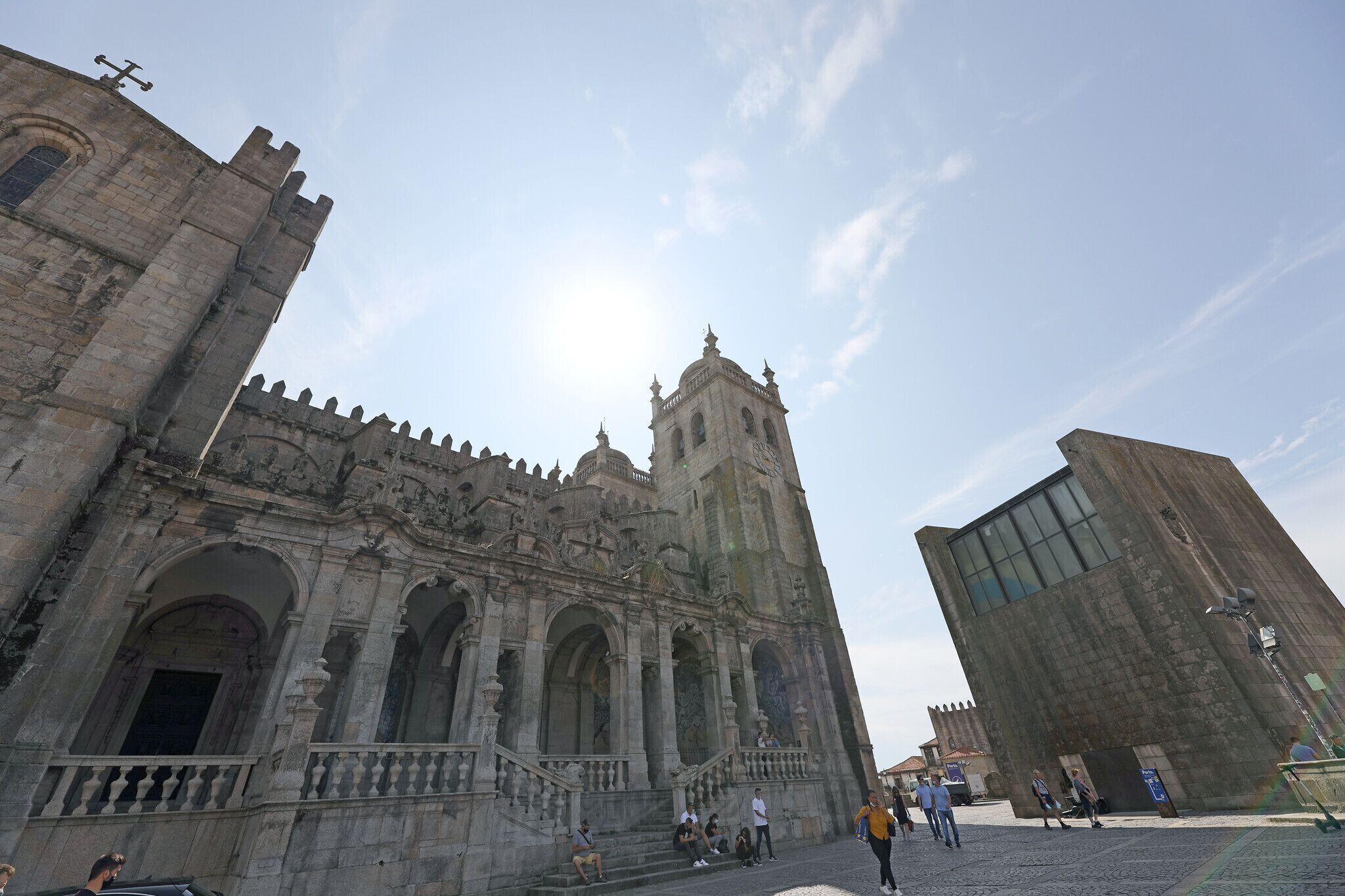 A historic building with a prominent tower and arched windows.