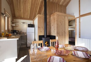 Chalet (Monana) | Private kitchen | Stovetop, highchair, cookware/dishes/utensils, cleaning supplies