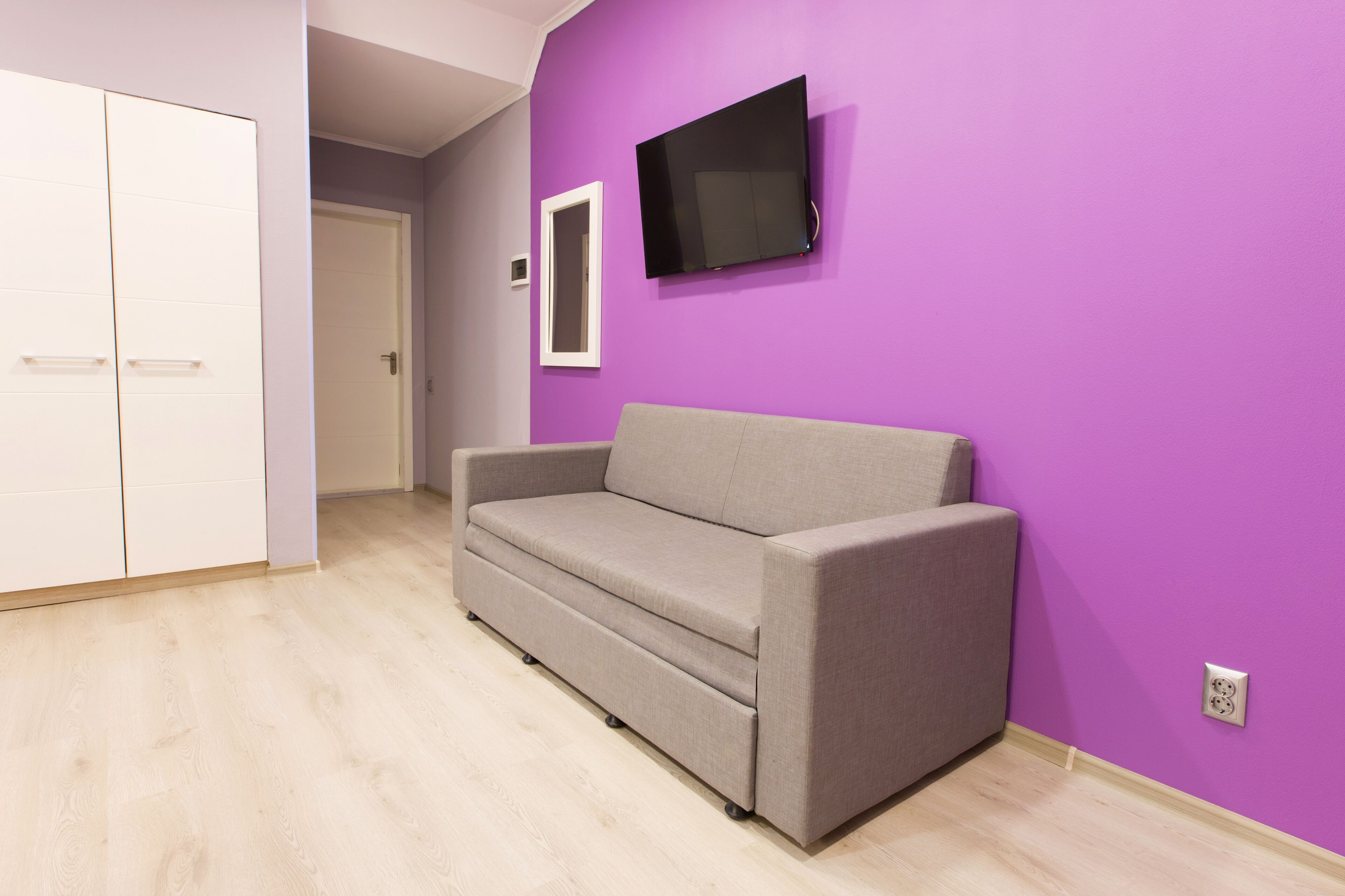 Vierbettzimmer, Balkon | Wohnbereich | Flachbildfernseher