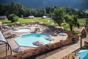 Indoor pool, seasonal outdoor pool, pool umbrellas, pool loungers