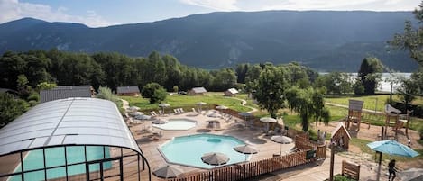 Indoor pool, seasonal outdoor pool, pool umbrellas, pool loungers