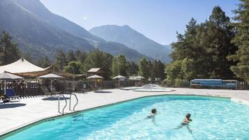 Seasonal outdoor pool, open 9:00 AM to 6:00 PM, pool umbrellas