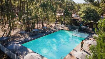 Seasonal outdoor pool, open 9:00 AM to 6:00 PM, pool umbrellas