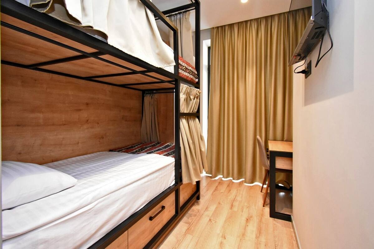Desk, blackout drapes, soundproofing, WiFi (free)
