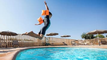 Seasonal outdoor pool, open 9:00 AM to 6:00 PM, pool umbrellas