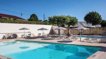 Seasonal outdoor pool, open 10:00 AM to 8:00 PM, sun loungers