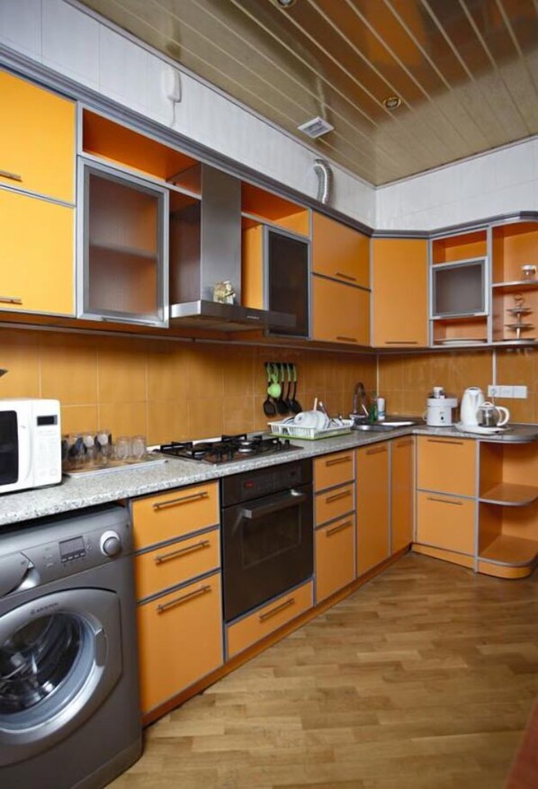 Family Apartment, Balcony, Sea View | Private kitchen | Full-size fridge, microwave, oven, stovetop