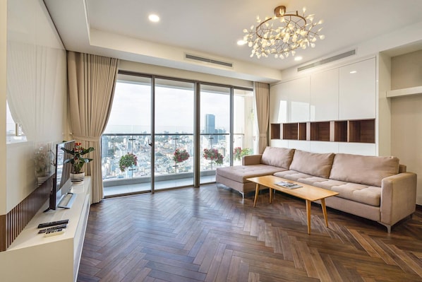 Luxury Apartment, 3 Bedrooms | Living area | 32-inch flat-screen TV with satellite channels, TV - Thai Anh House - Masteri Millenium (Ho Chi Minh City)