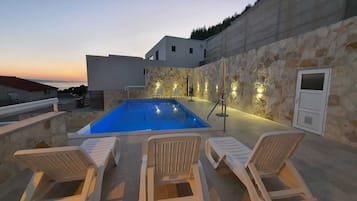 Seasonal outdoor pool, pool umbrellas, pool loungers