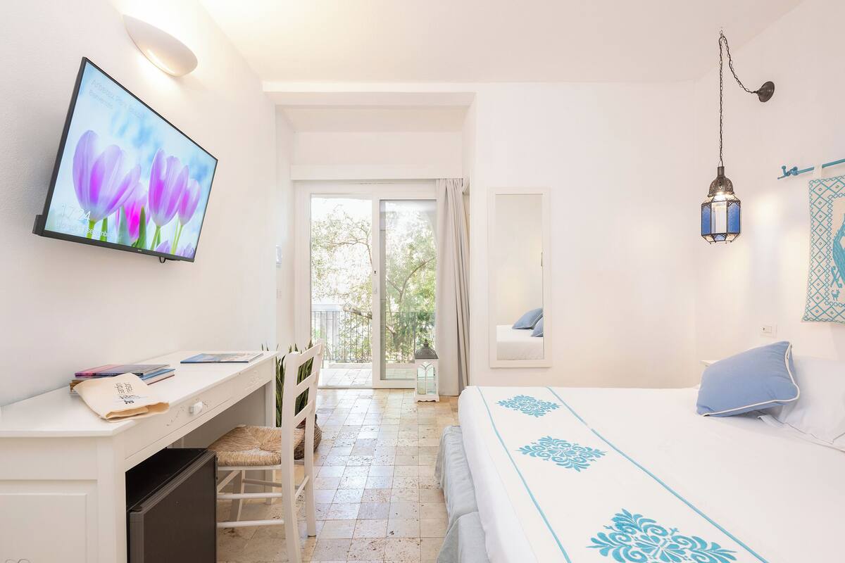 Tripla Superior con Terrazza | Minibar, in-room safe, desk, WiFi