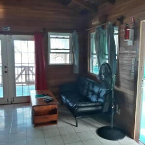 Cabin, Kitchenette, Sea View | Living area | 32-inch TV with cable channels - Coco's Beachfront Cabanas (Placencia)