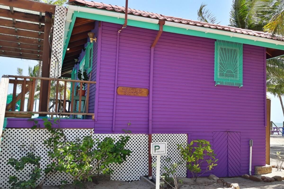 A purple building with a sign reading "Seaside Suitea".