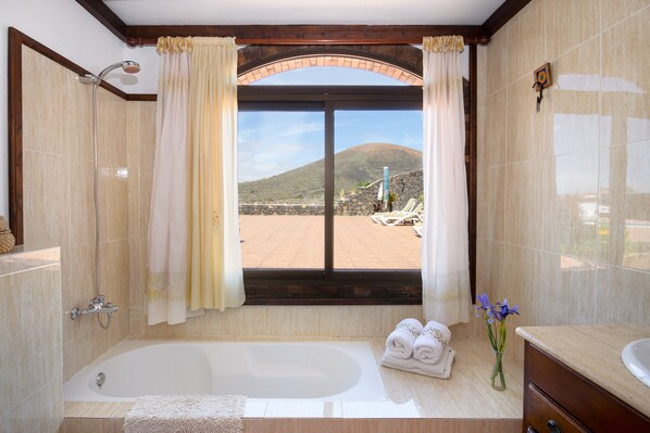 Bathtub, hair dryer, towels