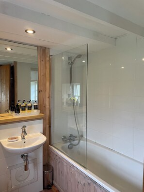 Combined shower/tub, hair dryer, towels, soap