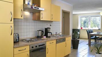 Fridge, stovetop, dishwasher, coffee/tea maker