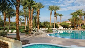 A swimming pool with palm trees and lounge chairs. - COACHELLA FEST ... 9th- 13th April 2020 (Palm Desert)