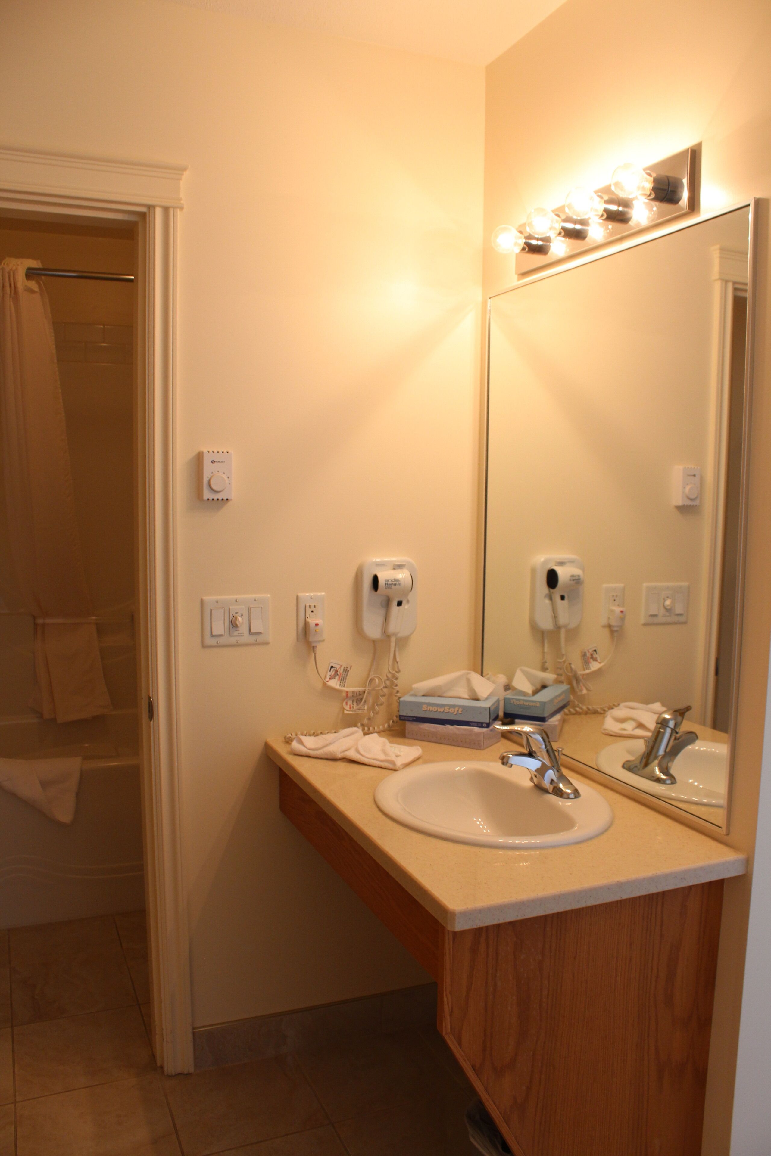 Comfort Room, 1 Queen Bed | Bathroom | Combined shower/tub, hair dryer, towels, soap