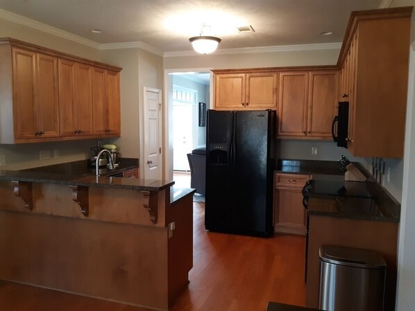 Microwave, dishwasher, coffee/tea maker, cookware/dishes/utensils