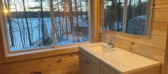 5 bed 4 bath in the Basin of Sebago Lake with 200 ft. of shared beach frontage