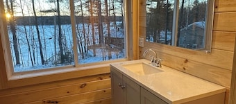 5 bed 4 bath in the Basin of Sebago Lake with 200 ft. of shared beach frontage