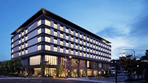 A modern hotel with a flat facade, multiple floors, and large windows. - JW Marriott Hotel Nara (Nara)
